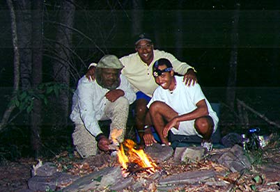 Heru, Bryon and Quinn at campfire